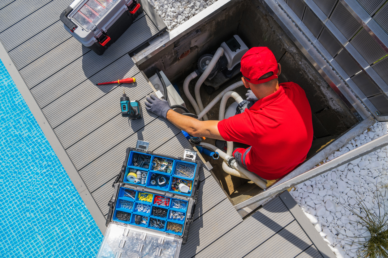 Technician Working On Pool Pump