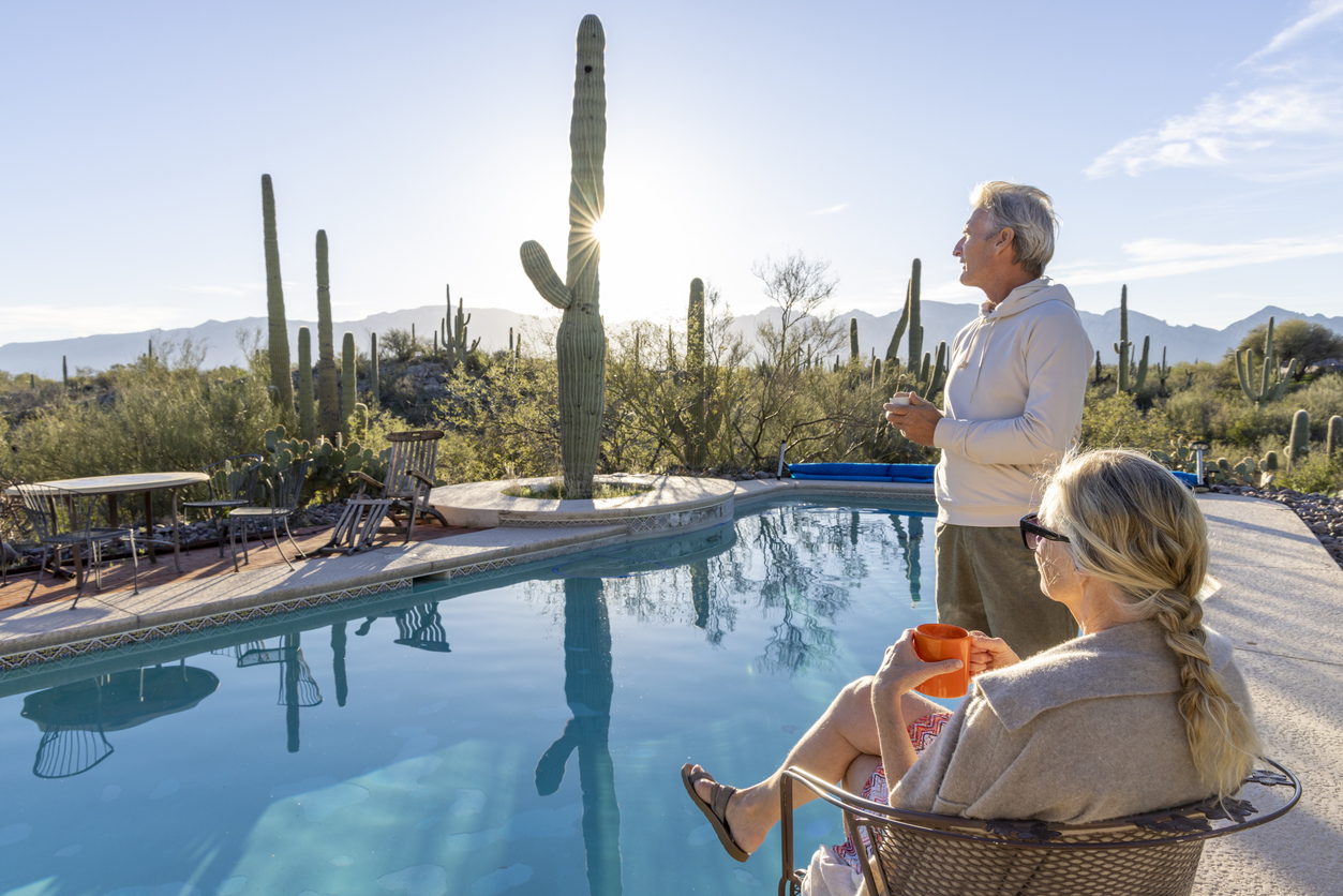 Couple Relaxing By Clean Pool