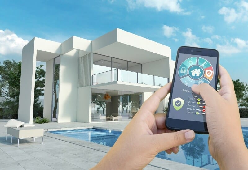 Person controlling automated pool system with phone app